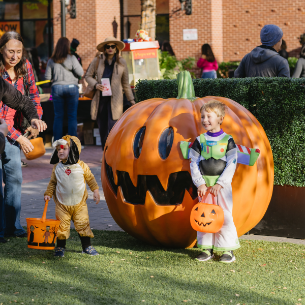Child posing for a photo at Fall Fest at The Avenue West Cobb in Marietta, GA